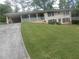 Brick ranch house with covered porch and large yard at 3536 Redwine Ct, Atlanta, GA 30344