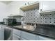 Kitchen details, sink, and black and white tile backsplash at 3103 Reeves Se St, Smyrna, GA 30080