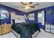 Main bedroom with a plush bed and dark blue walls at 3103 Reeves Se St, Smyrna, GA 30080