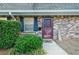 Brick townhome entrance with purple door and landscaping at 3103 Reeves Se St, Smyrna, GA 30080