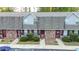 Three-unit brick townhouse building with ample parking at 3103 Reeves Se St, Smyrna, GA 30080