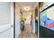 Entry hallway with unique wallpaper and wood-look flooring at 3103 Reeves Se St, Smyrna, GA 30080