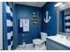 Nautical-themed bathroom with blue walls and white vanity at 3103 Reeves Se St, Smyrna, GA 30080