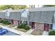Three-unit brick townhouse building with parking and landscaping at 3103 Reeves Se St, Smyrna, GA 30080