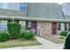 Brick front exterior of townhome with landscaping and walkway at 3103 Reeves Se St, Smyrna, GA 30080
