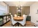 Dining area with wood table and black and white wall at 3103 Reeves Se St, Smyrna, GA 30080