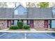 Brick townhouses with gray roofs and well-maintained landscaping at 3103 Reeves Se St, Smyrna, GA 30080