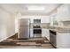 Modern kitchen boasting stainless steel appliances and granite countertops at 2648 Santa Monica Nw Dr, Atlanta, GA 30318