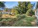 Partially wooded backyard with mature trees and landscaping at 2648 Santa Monica Nw Dr, Atlanta, GA 30318