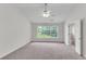 Large main bedroom with ceiling fan and carpet at 621 Kenridge Way # 0, Suwanee, GA 30024