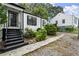 Charming white house with black accents and a well-maintained yard at 4118 Clairmont Rd, Chamblee, GA 30341