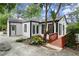 White house with black trim, deck, and walkway at 4118 Clairmont Rd, Chamblee, GA 30341