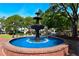 Ornate fountain in a brick-lined basin, surrounded by trees at 260 Manning Sw Rd # 127, Marietta, GA 30064