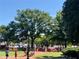 Town square with a fountain, trees, and pedestrians at 260 Manning Sw Rd # 127, Marietta, GA 30064