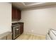 Basement wet bar with granite countertop and wine cooler at 1236 Minhinette Dr, Roswell, GA 30075