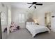 Charming bedroom with white bedding and plenty of natural light at 1236 Minhinette Dr, Roswell, GA 30075