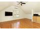 Bright bonus room with hardwood floors, large window, and kitchenette at 1236 Minhinette Dr, Roswell, GA 30075