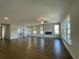 Spacious living room with hardwood floors, fireplace, and large windows at 3402 Wild Clary Ct, Buford, GA 30519