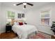 Bedroom with hardwood floors, ceiling fan and two windows at 3018 Wanda Sw Cir, Atlanta, GA 30315