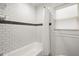 Clean bathroom with white subway tile and bathtub at 3018 Wanda Sw Cir, Atlanta, GA 30315
