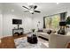 Living room with hardwood floors and a comfy seating area at 3018 Wanda Sw Cir, Atlanta, GA 30315