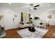 Hardwood floor living room with cozy furniture and large window at 3018 Wanda Sw Cir, Atlanta, GA 30315