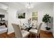Bright dining room with glass table and hardwood floors at 3018 Wanda Sw Cir, Atlanta, GA 30315