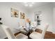 Bright dining room with glass table and four chairs, offering view to kitchen at 3018 Wanda Sw Cir, Atlanta, GA 30315