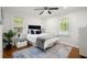 Bright bedroom with hardwood floors, ceiling fan and large windows at 3018 Wanda Sw Cir, Atlanta, GA 30315