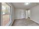 Bedroom with carpet, double closet, and window at 245 Southmoor Cir, Stockbridge, GA 30281
