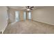 Spacious bedroom with carpet, ceiling fan, and access to a bathroom at 245 Southmoor Cir, Stockbridge, GA 30281