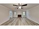 Spacious living room with fireplace and new flooring at 245 Southmoor Cir, Stockbridge, GA 30281
