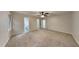 Spacious bedroom with carpet, ceiling fan, and access to a bathroom at 245 Southmoor Cir, Stockbridge, GA 30281