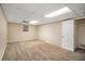 Unfinished basement with carpeted floor and a closet at 245 E Simon Nw Ter, Atlanta, GA 30318