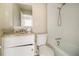 Bathroom with granite countertop, white cabinets, and a bathtub at 245 E Simon Nw Ter, Atlanta, GA 30318