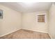 Simple bedroom with carpeted floor and a window at 245 E Simon Nw Ter, Atlanta, GA 30318