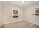 Well-lit bedroom with neutral colored walls and carpeting at 245 E Simon Nw Ter, Atlanta, GA 30318