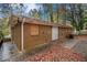 Rear view of a brick house with boarded windows at 245 E Simon Nw Ter, Atlanta, GA 30318