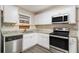 Modern kitchen featuring white cabinets and granite countertops at 245 E Simon Nw Ter, Atlanta, GA 30318