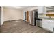 Eat-in kitchen with stainless steel appliances and new flooring at 245 E Simon Nw Ter, Atlanta, GA 30318