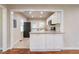 Modern kitchen with white cabinets, granite countertops, and stainless steel appliances at 1790 Ledo Ave, Decatur, GA 30035