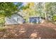 House and detached garage in wooded backyard setting at 1790 Ledo Ave, Decatur, GA 30035