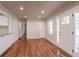 Spacious living room with hardwood floors, recessed lighting, and access to other rooms at 1790 Ledo Ave, Decatur, GA 30035