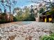 Community pool area with adjacent building and autumn leaves at 8710 Mount Rushmore Dr, Alpharetta, GA 30022