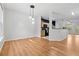 Open dining room with view into kitchen and wood floors at 2357 Bayrose Cir # 57B, East Point, GA 30344