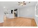 Bright living room with hardwood floors and open concept to kitchen at 2357 Bayrose Cir # 57B, East Point, GA 30344