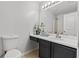 Bathroom boasts dark vanity, updated fixtures and shower at 2357 Bayrose Cir # 57B, East Point, GA 30344