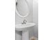Modern powder room with pedestal sink and large mirror at 2357 Bayrose Cir # 57B, East Point, GA 30344