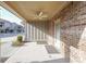 Covered patio with ceiling fan and brick exterior at 4842 Miller Ridge Blvd, Buford, GA 30518