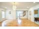 Living room with hardwood floors, chandelier, and entryway view at 7156 Waters Edge Dr, Stone Mountain, GA 30087